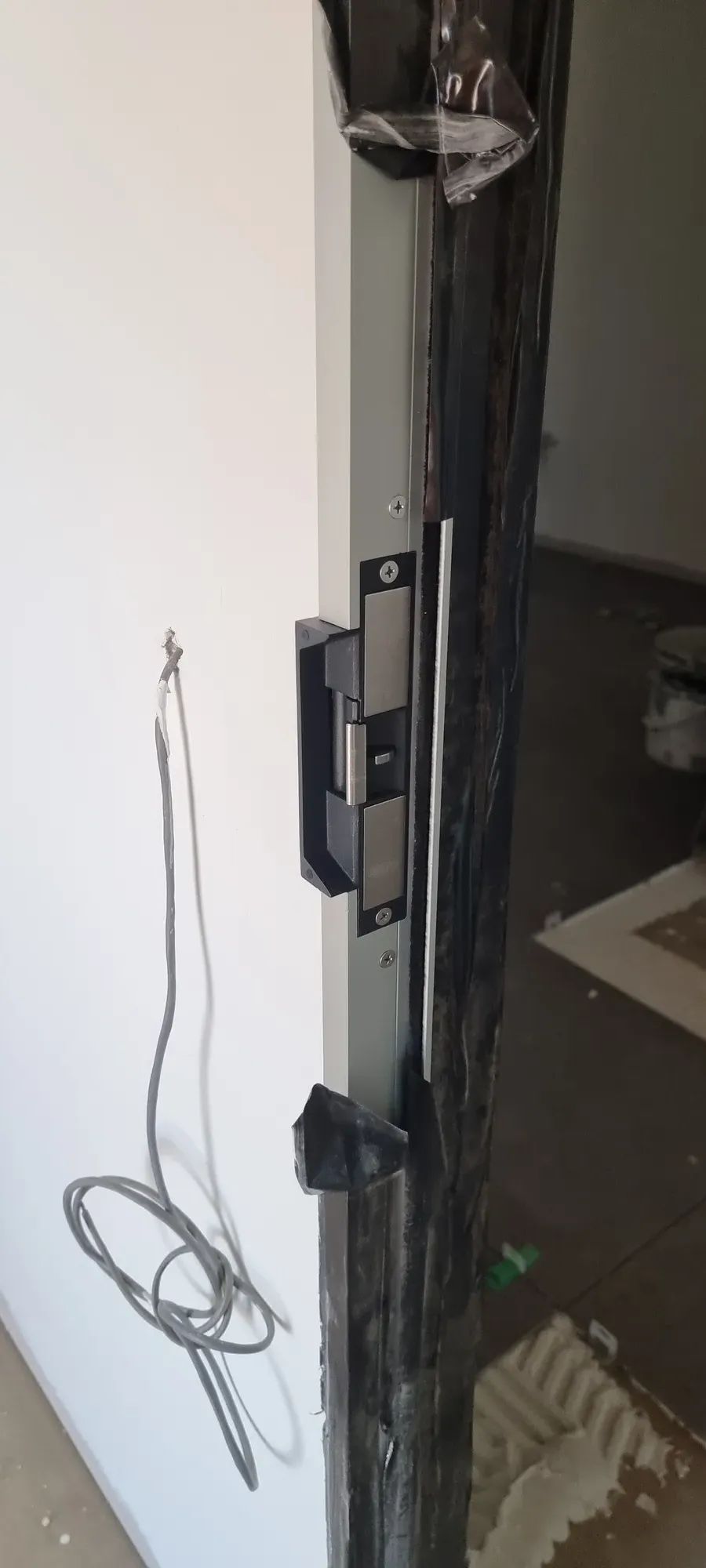 An electric strike installed in a door frame