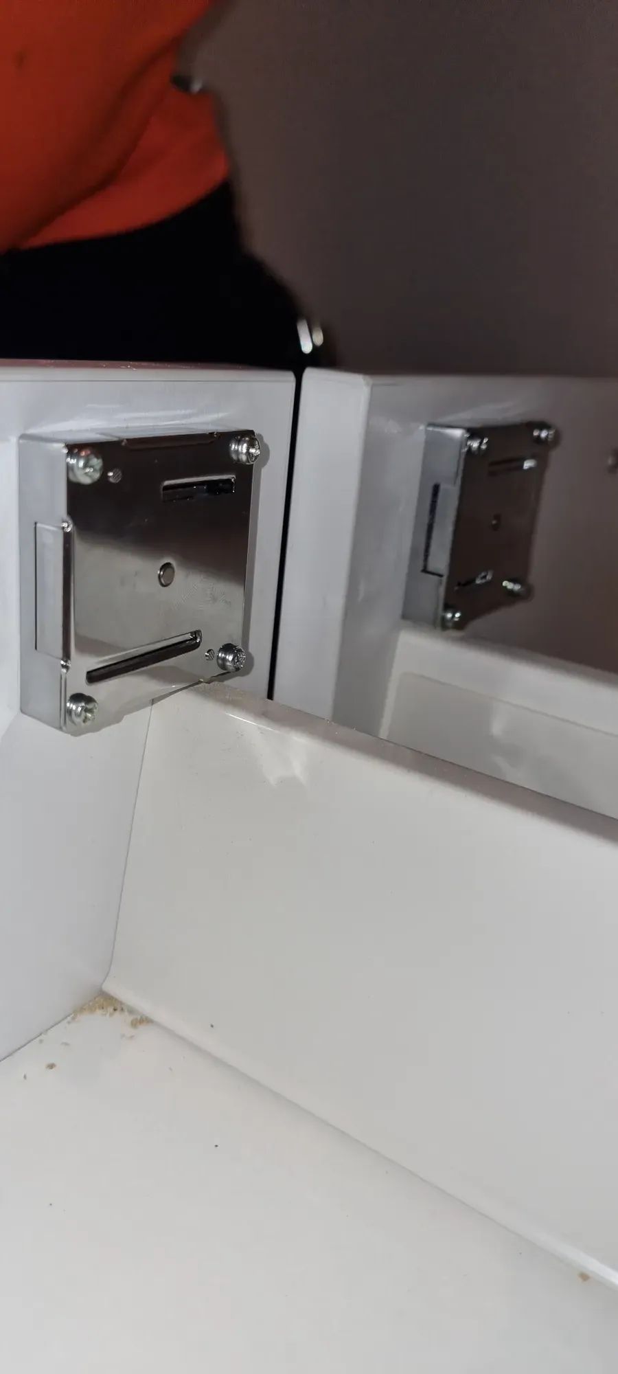 A stainless lever lock being serviced on a commercial door