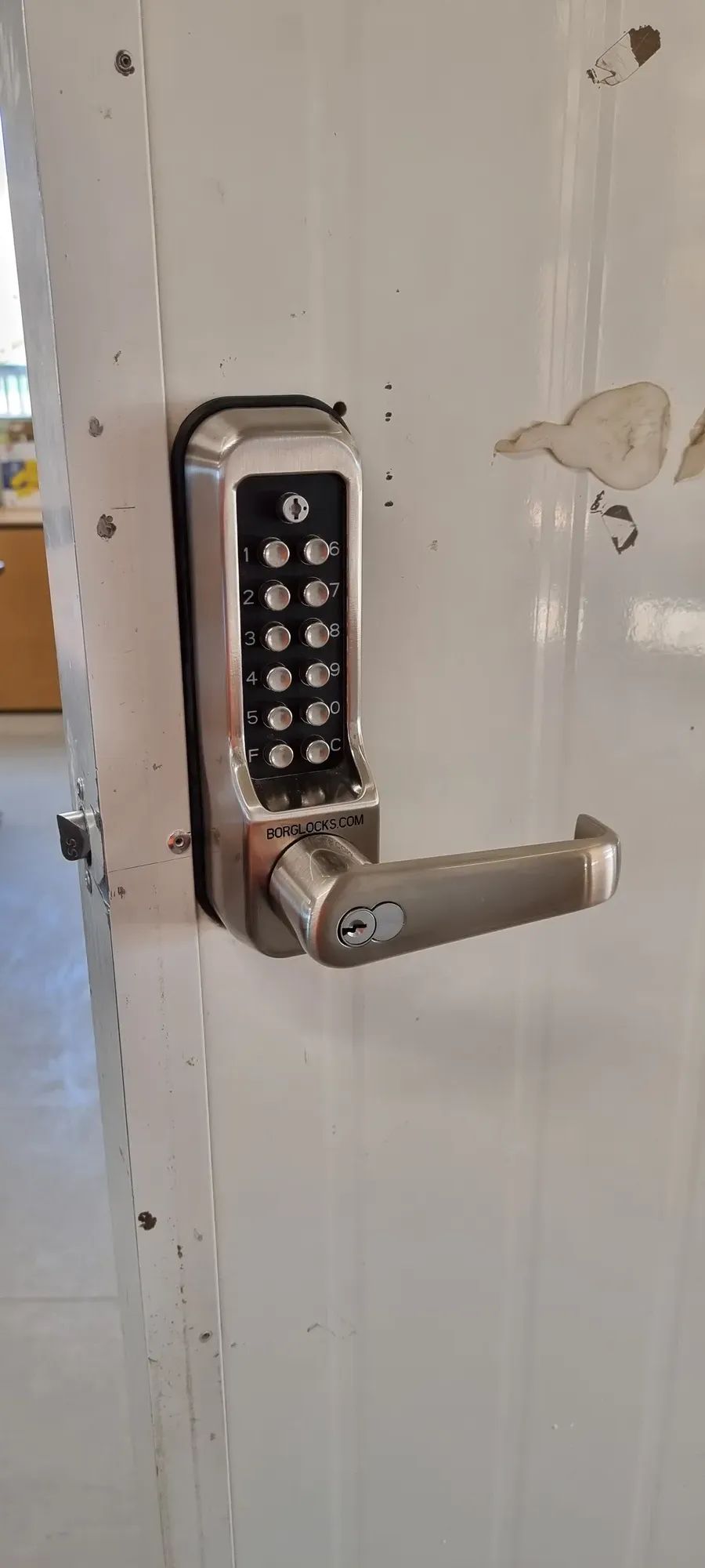 A heavy-duty mechanical keypad lock with a lever handle